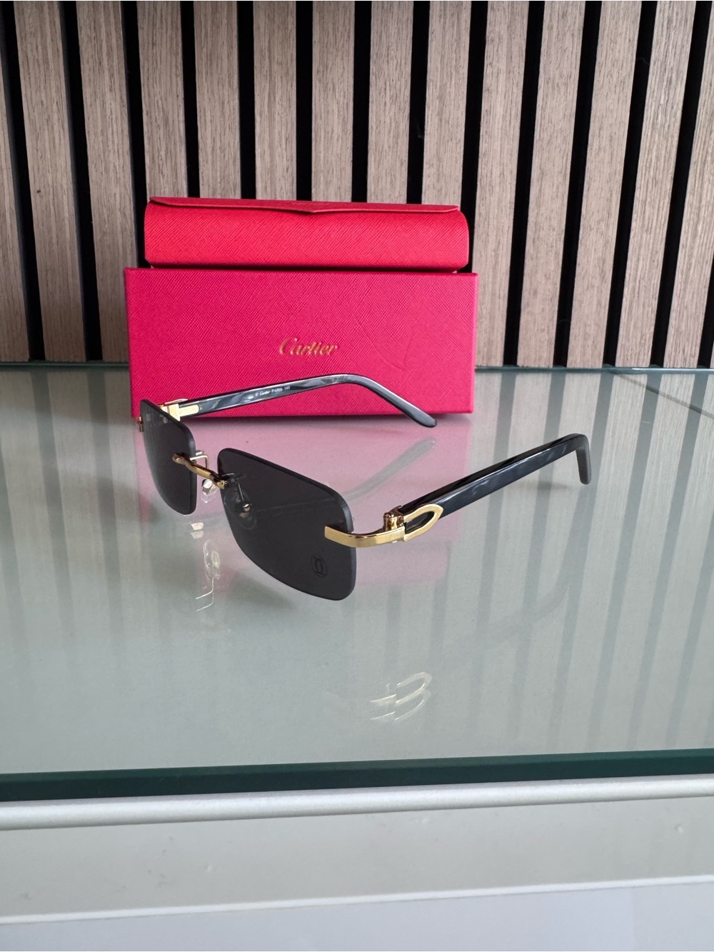Cartier Black and Gold Rimless Sunglasses with Red Case